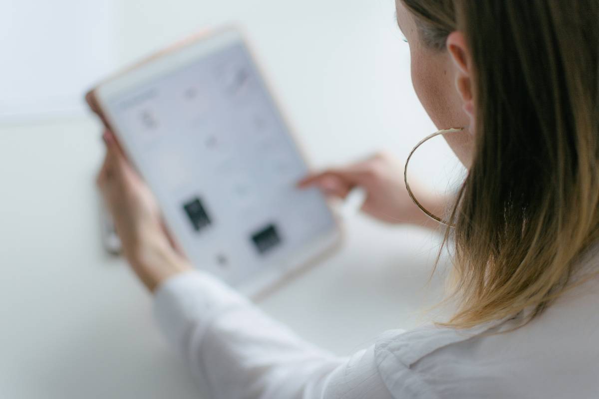 Child using a word fluency app on tablet with visual word cues and audio feedback